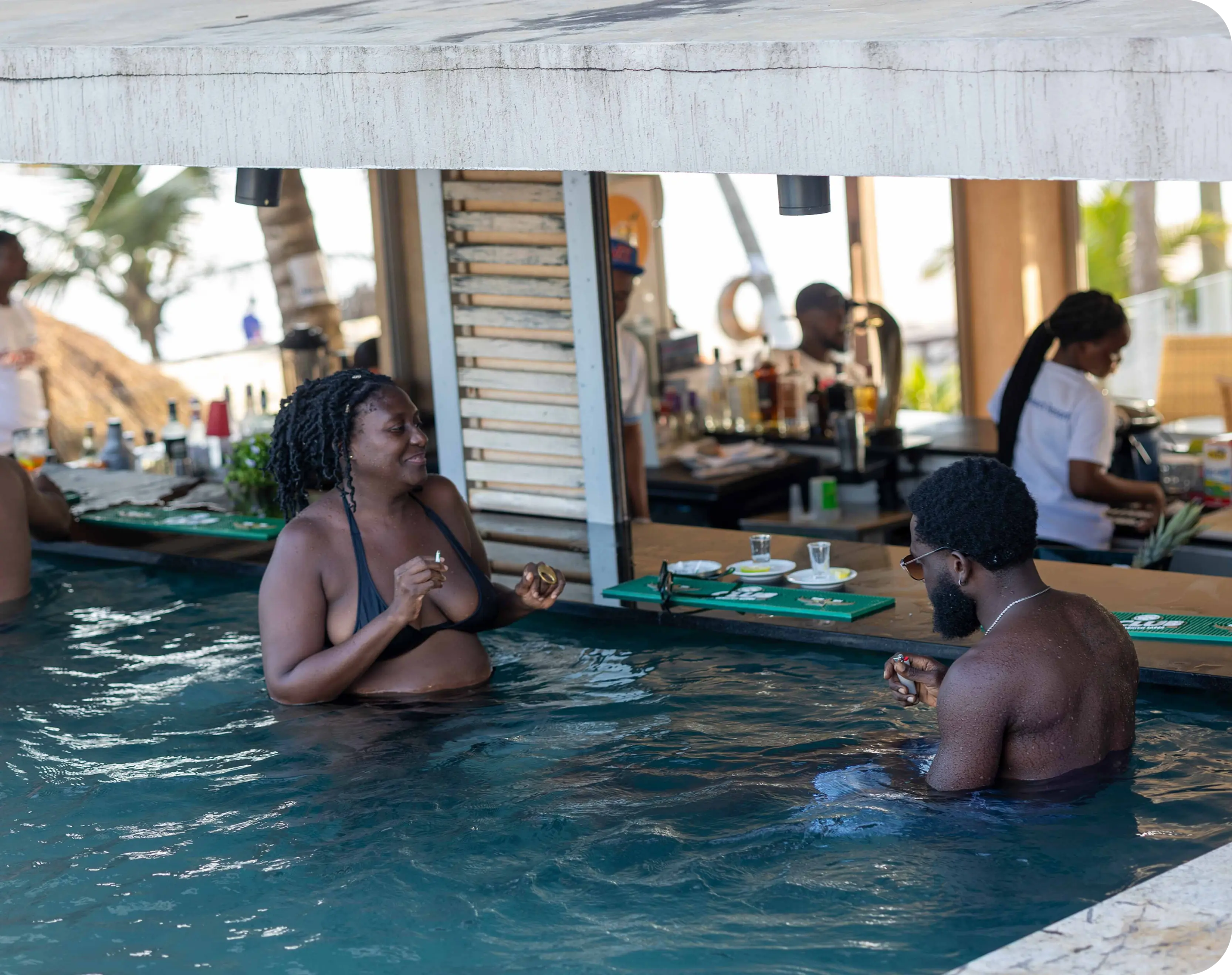 Guests relaxing at the swim-up pool bar